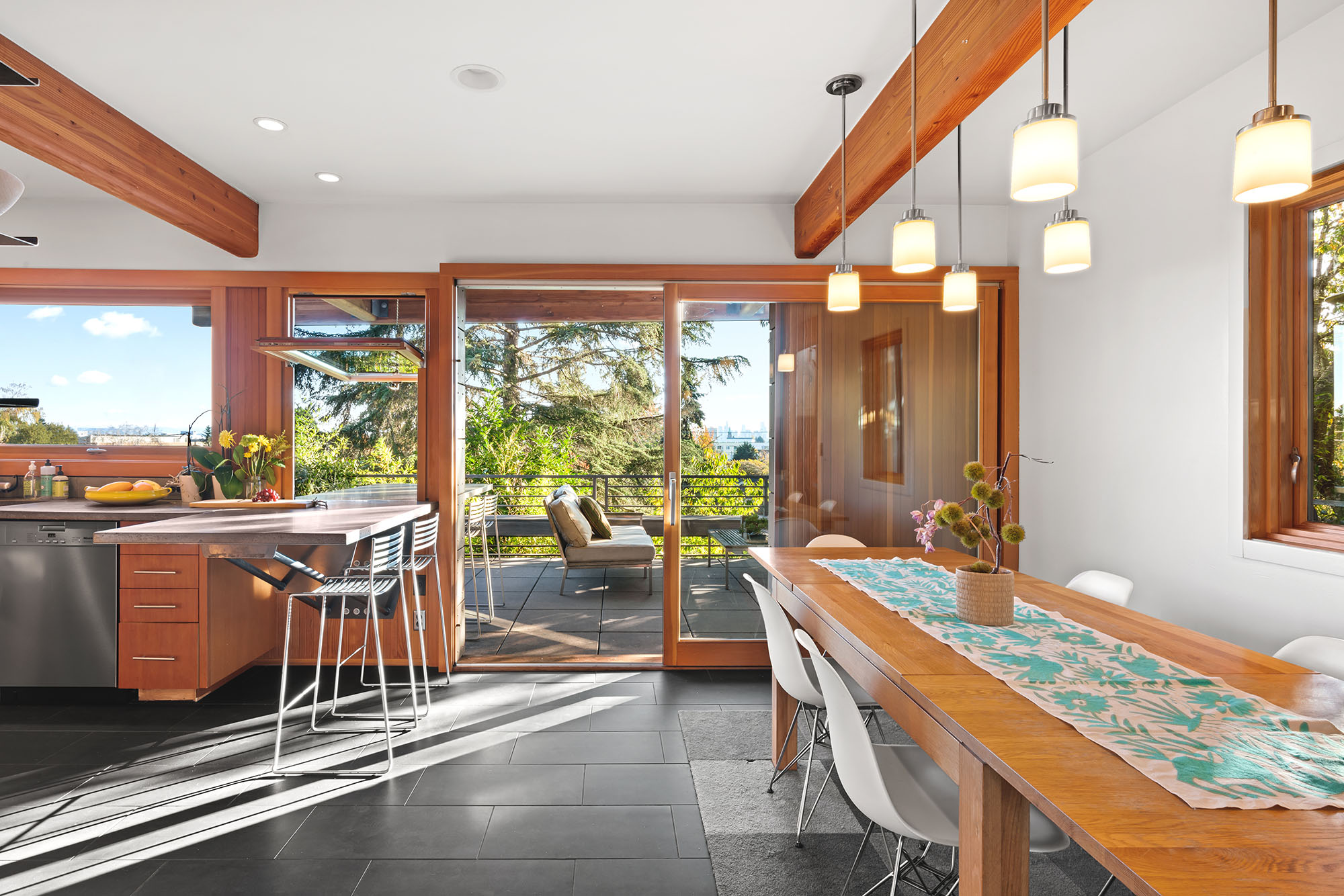 Dining area connected to deck and views